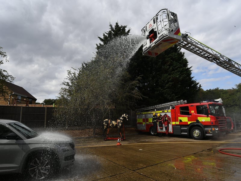 Stanground fire fighters and volunteers at their annual car wash at the Fire Station. EMN-211209-160803009