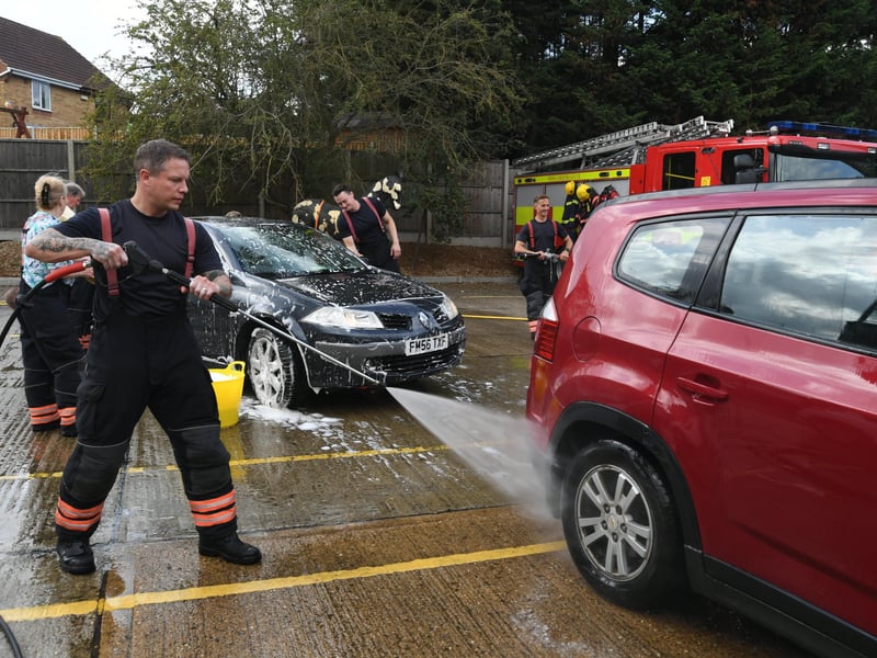Stanground fire fighters and volunteers at their annual car wash at the Fire Station. Pictures: David Lowndes