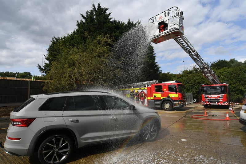 Stanground fire fighters and volunteers at their annual car wash at the Fire Station. EMN-211209-160825009