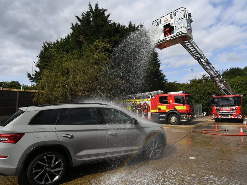 Stanground fire fighters and volunteers at their annual car wash at the Fire Station. EMN-211209-160825009
