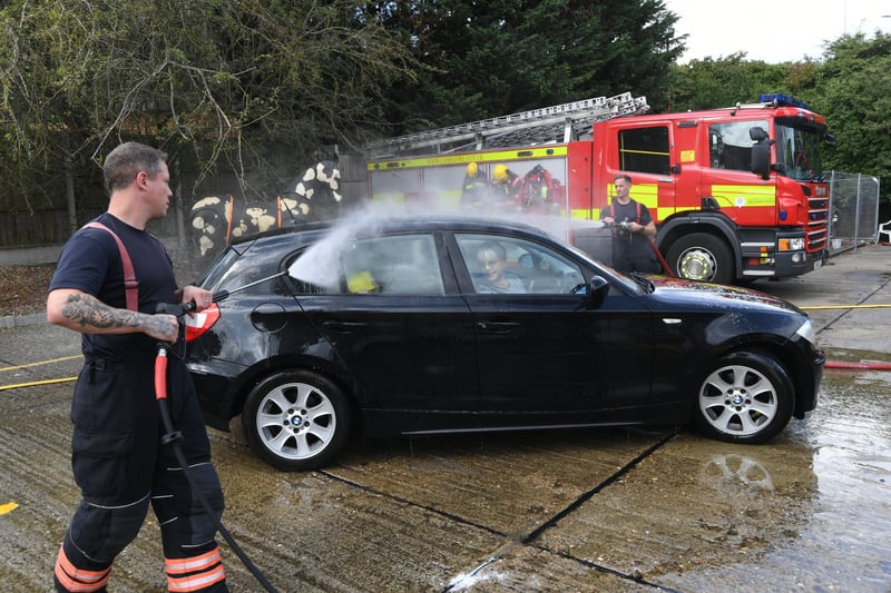 Stanground fire fighters and volunteers at their annual car wash at the Fire Station. EMN-211209-160717009