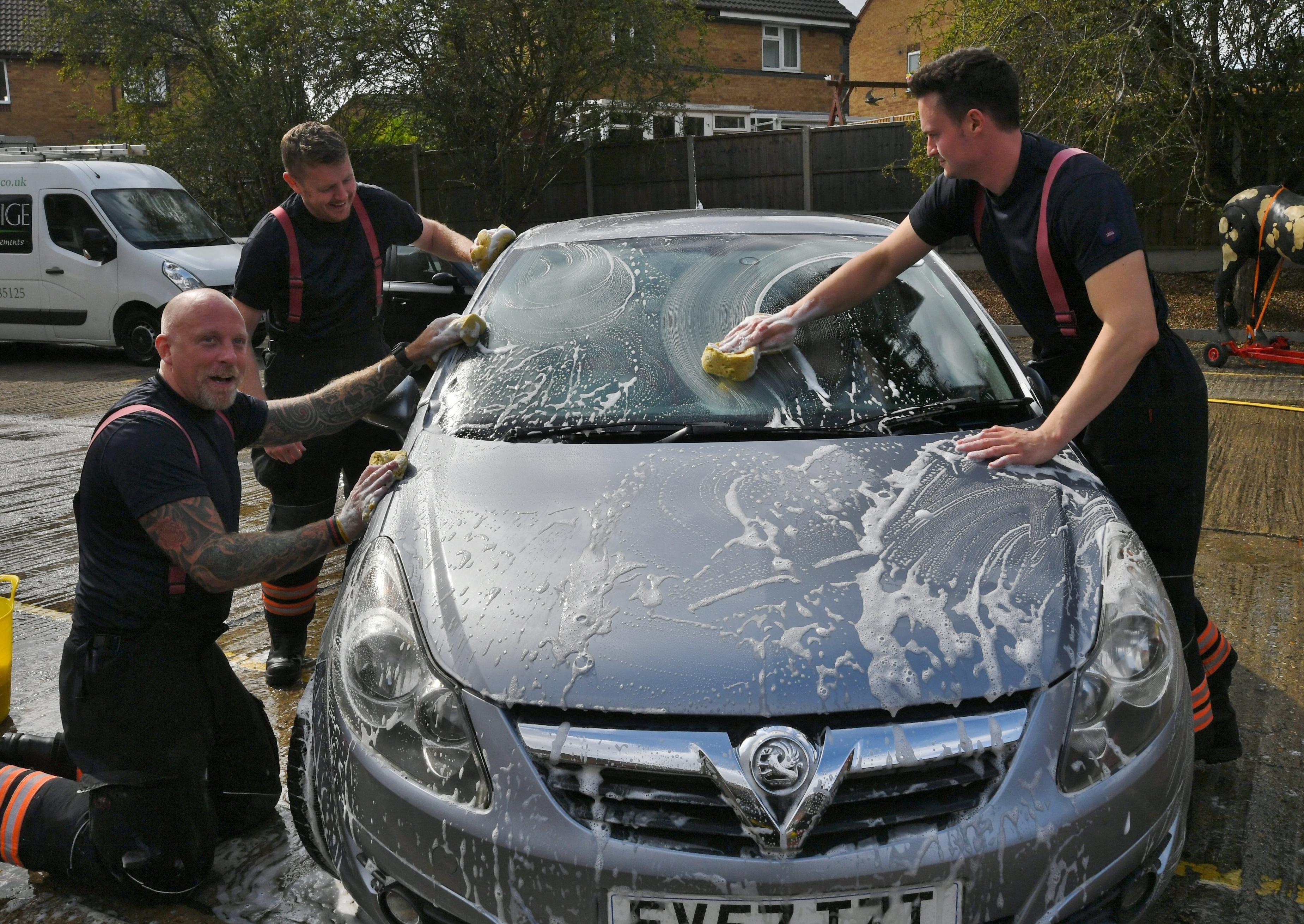 Stanground fire fighters and volunteers at their annual car wash at the Fire Station. Pictures: David Lowndes