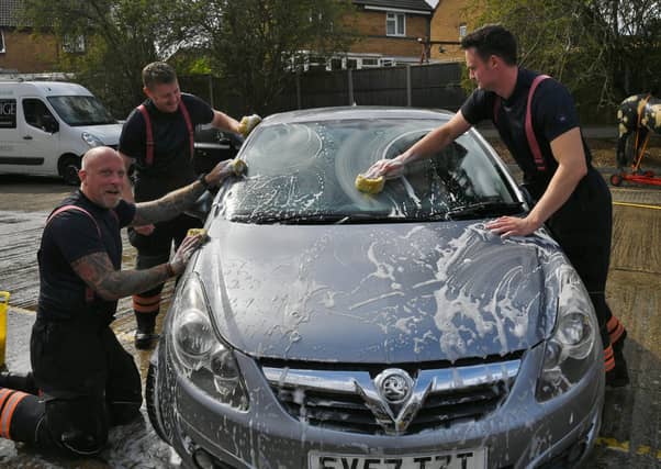 Stanground fire fighters and volunteers at their annual car wash at the Fire Station. Pictures: David Lowndes