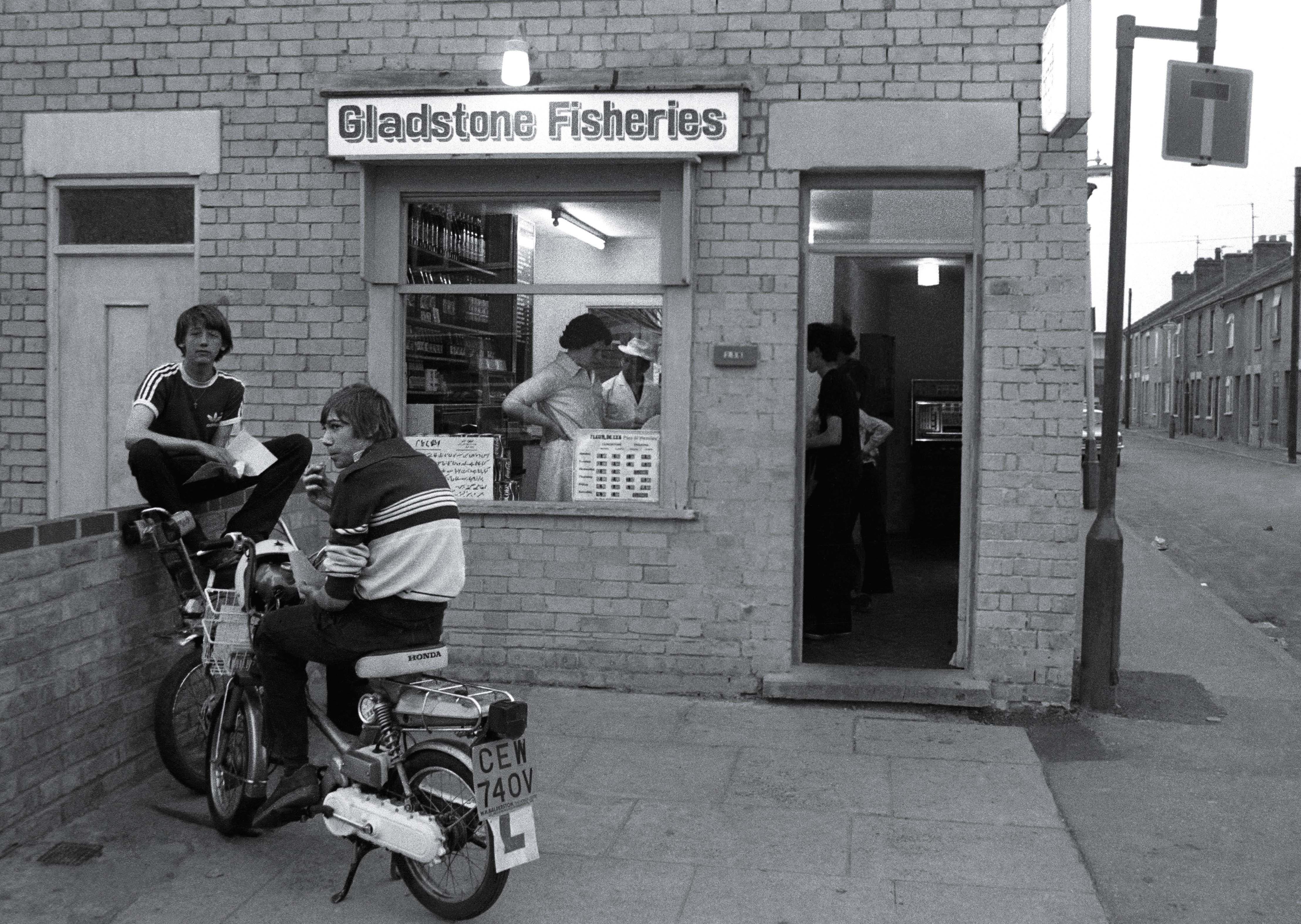 Chris Porsz's picture of Steven Zenczuk sitting on the wall outside Mick’s fish and chip shop in Gladstone Street... He went on to play in goal for Peterborough United.