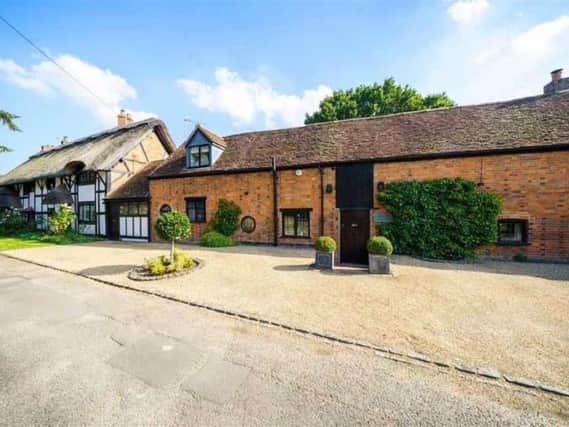 The part thatched Grade II listed home in Barford has gone on the market. Photo by ehB Residential