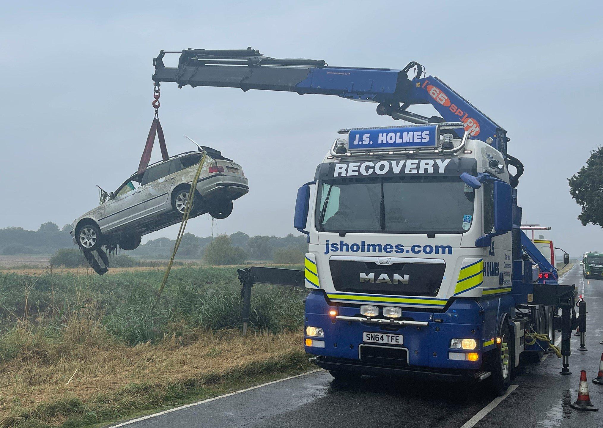 A white BMW was retrieved from water next to Twenty Foot Road in March.
