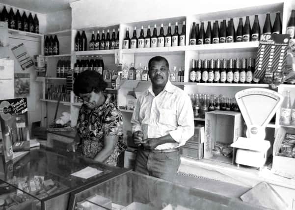 Do you recognise this Peterborough shop pictured in the 80s or the people behind the counter?