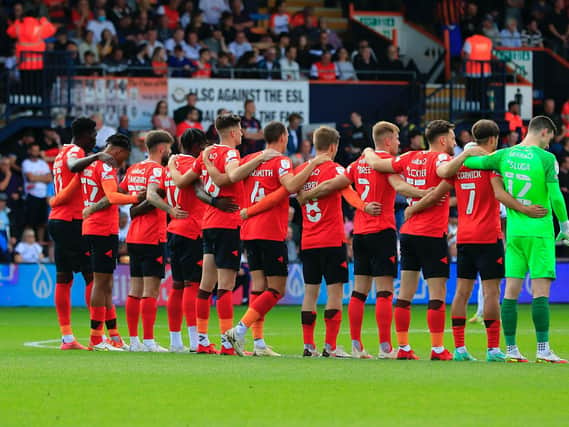 The Luton Town players line-up before Saturday's game