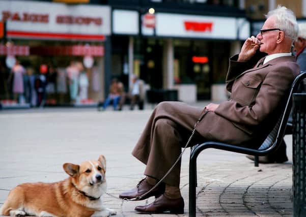 Do you recognise this gentleman taking a break with his Corgi?