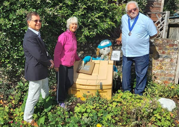 Let's hope this volunteer litter picker has mistaken the grit box for a bin for too long, otherwise Lancing might be about to have a very interesting winter!