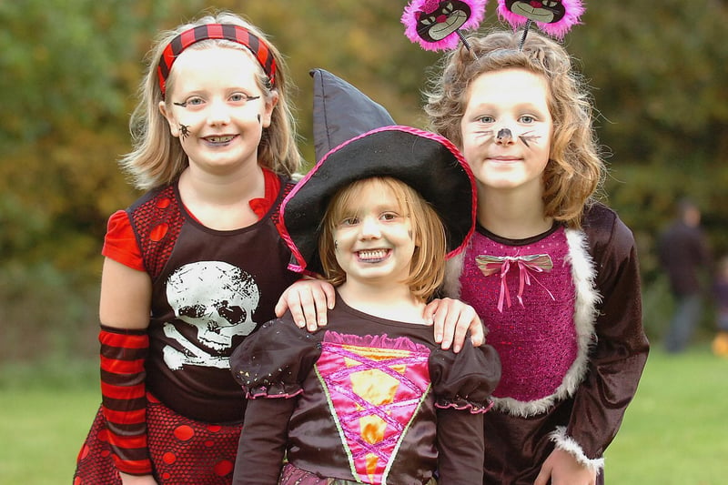 All dressed up in 2011 are Katie Payne, Jessica Payne and Taylor Brooks.