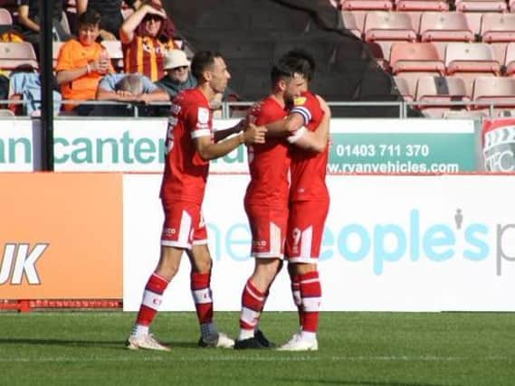 Crawley Town celebrate Will Ferry's opener. Picture by Cory Pickford