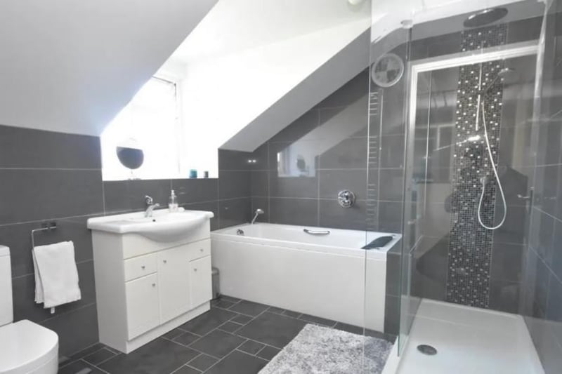 The communal bathroom is an ideal one stop shop, with a walk-in shower, vanity basin, WC and bath.