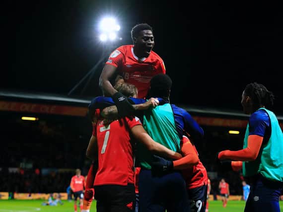 Elijah Adebayo celebrates Harry Cornick's second goal of the night against Coventry