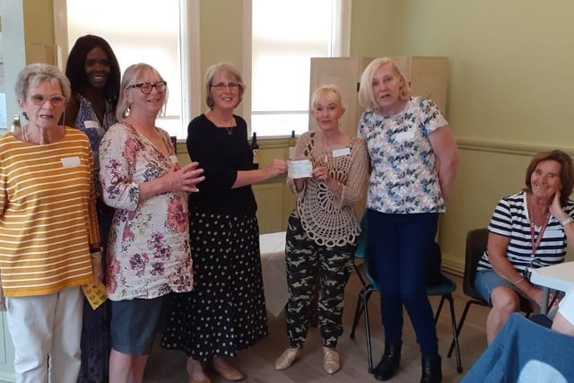 Members of BreatheEasy Eastbourne,returned to their first live monthly meeting after lockdown. Guest Sandra Jay from the Micheldene Women’s Institute East Dean presented BreatheEasy with a cheque for £555 at the group’s cream tea.