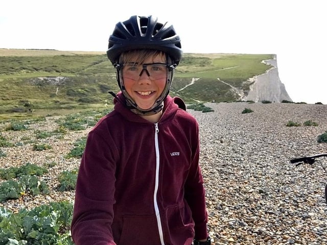 A teenager who cycled 300 miles across Sussex raised hundreds of pounds for a cancer charity.