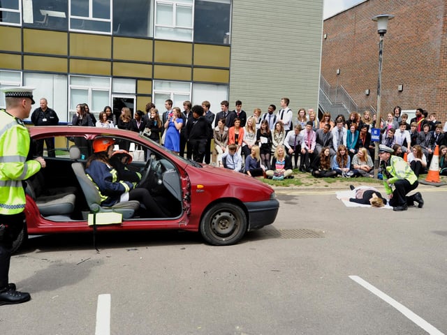 This picture looks dramatic - but it was actually a 2011 fire, police and ambulance exercise at the school. Sixth former Casey Bird, 17, was 'rescued'.