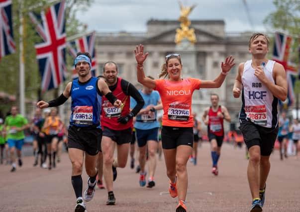 Runners at the finish line after completing the Virgin Money London Marathon, 28 April 2019.

 Photo: Thomas Lovelock for Virgin Money London Marathon. Archive image.