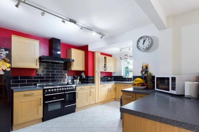 The open plan, modern fitted kitchen in the main building of the property.