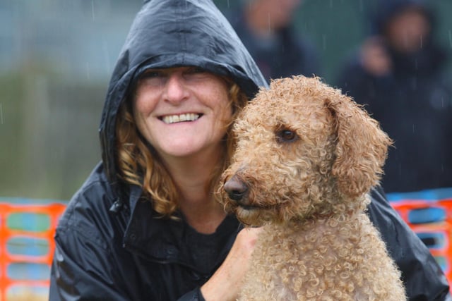 DM21100155a.jpg. Ardingly autumn show and game fair 2021. Tracy Hawkins and her dog Bear. Photo by Derek Martin Photography and Art. SUS-210410-101308008