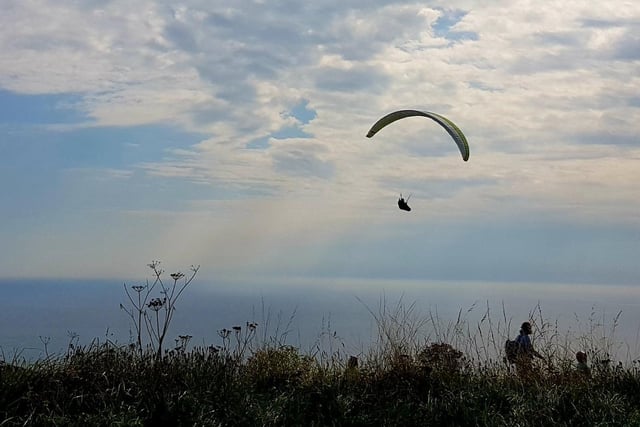 A paraglider takes to the sky at Beachy Head. "Great to see them majestic floating about the sky," said Bob Newton who took this picture near the Beachy Head public house. SUS-210510-102946001