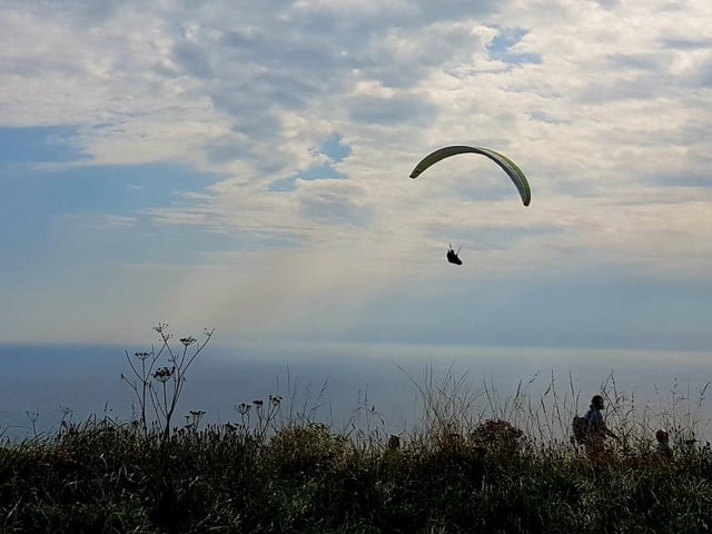 A paraglider takes to the sky at Beachy Head. "Great to see them majestic floating about the sky," said Bob Newton who took this picture near the Beachy Head public house. SUS-210510-102946001