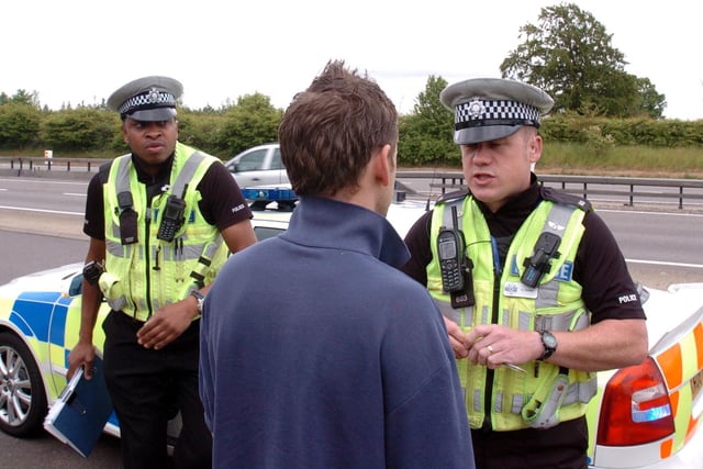 Kettering, Operations Tactical Unit police officers on patrol on A14. 
l-r PC Clive Mutemasango and PC Steve Thorpe in 2009