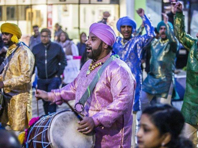 The parade is brought to life with diva lights, drummers and dancing