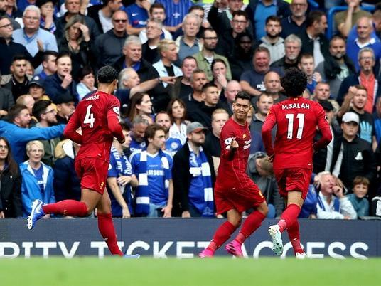 Roberto Firmino, second right, celebrates scoring Liverpool's second goal during the 2-1 win over Chelsea in September. Victory at Stamford Bridge extended the Reds' unbeaten start to six top-flight games