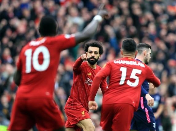 Mohamed Salah, centre, celebrates his 70th Premier League goal for Liverpool on his 100th top-flight appearance for the club during March's 2-1 win over Bournemouth