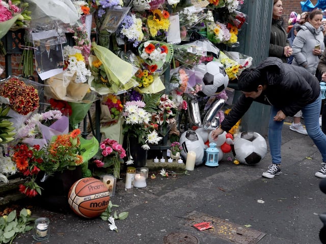A wall of floral tributes to 14 year-old Noah Donohoe.