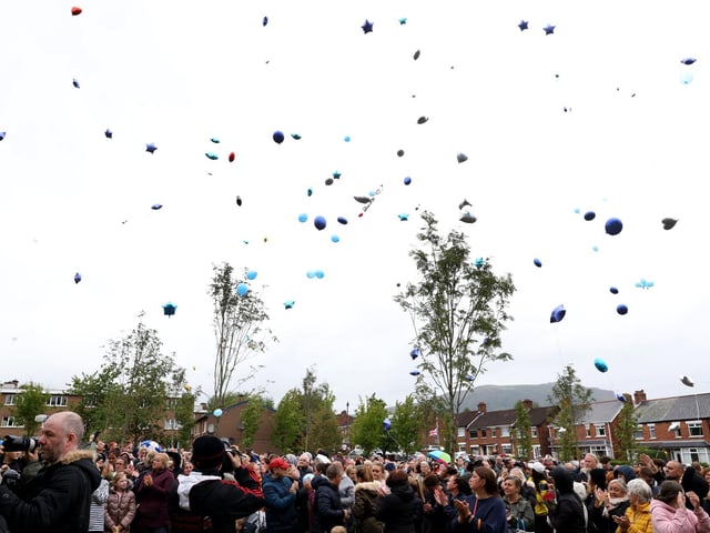 Members of the public released balloons too.