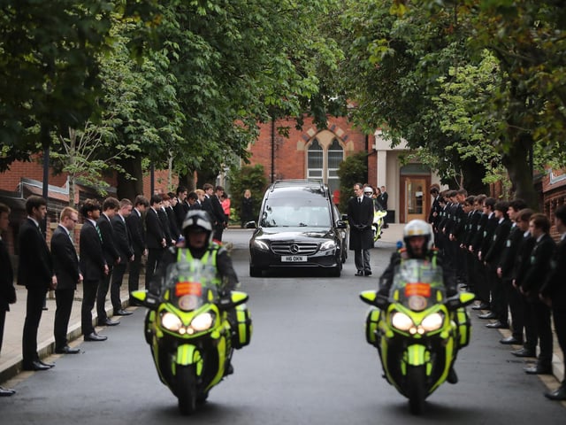 Noah Donohoe's funeral cortege begins to make its way to St. Patrick's Church in Belfast.