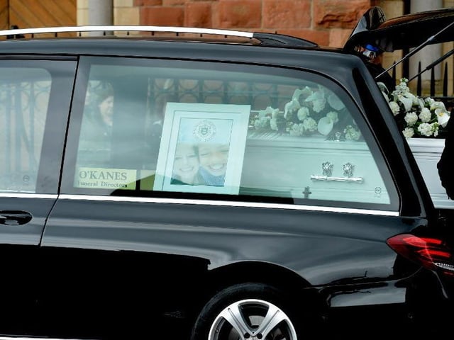 A photograph of Noah Donohoe and mum Fiona was placed beside his coffin.