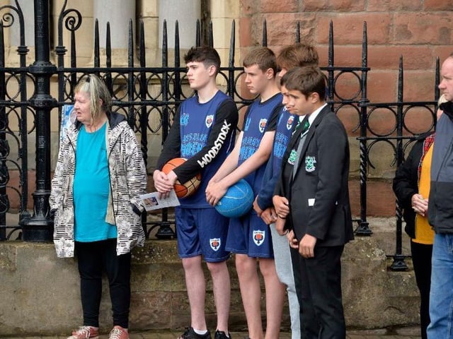 Friends and family gather outside the church.