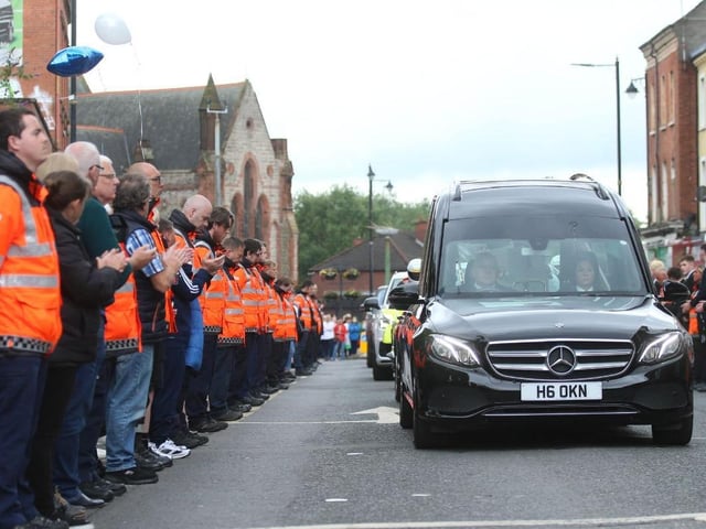 The hearse arrives at the church.
