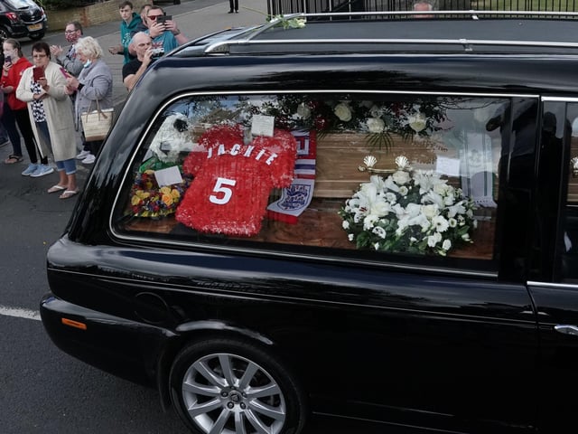 People line the streets as the funeral cortege of Jack Charlton passes through