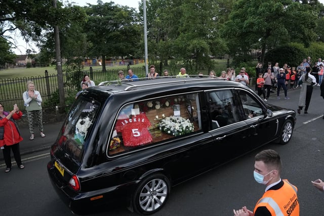People line the streets as the funeral cortege of Jack Charlton passes through