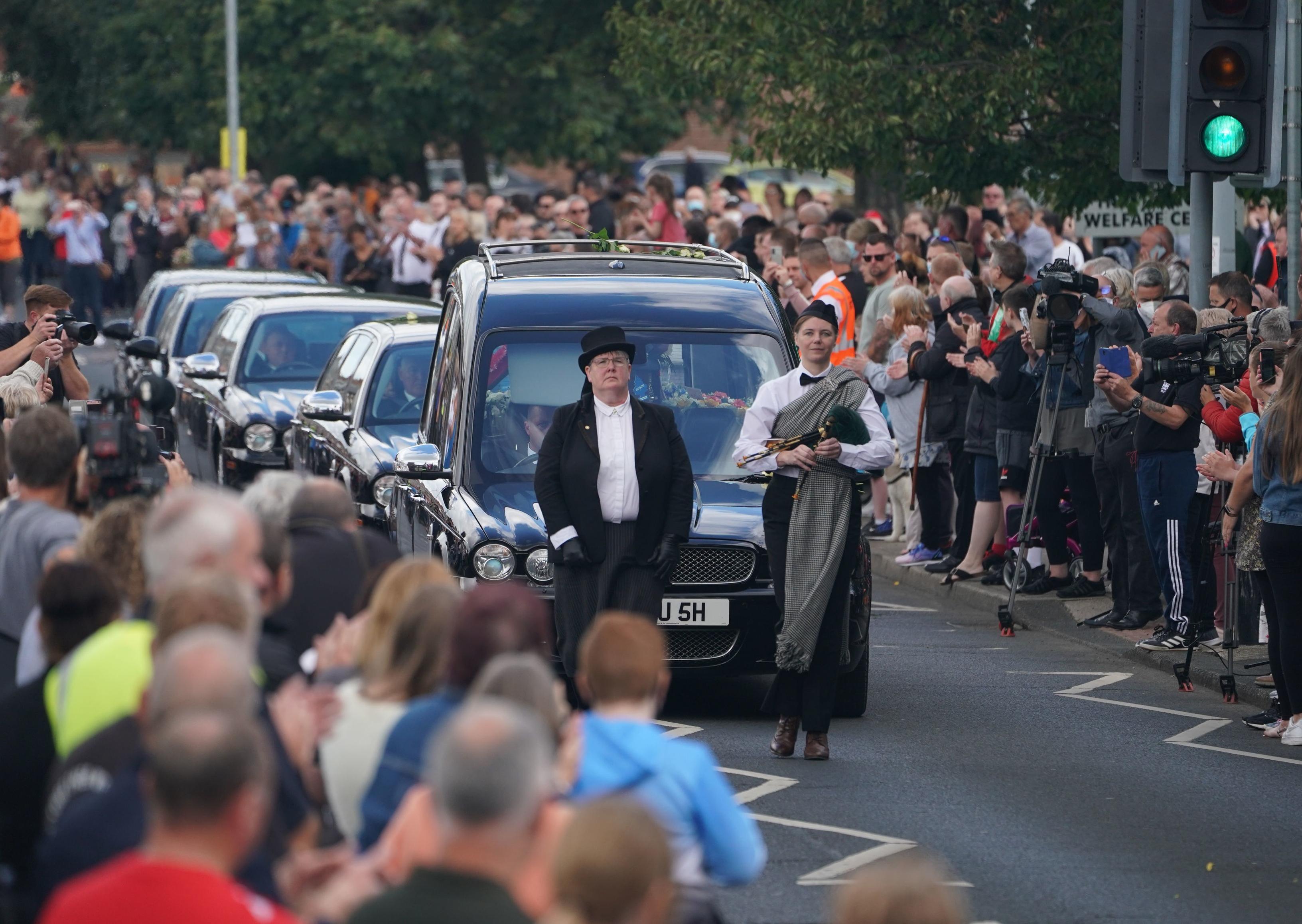 People line the streets as the funeral cortege of Jack Charlton passes through his hometown of Ashington, in Northumberland ahead of his funeral service at West Road Crematorium, in Newcastle