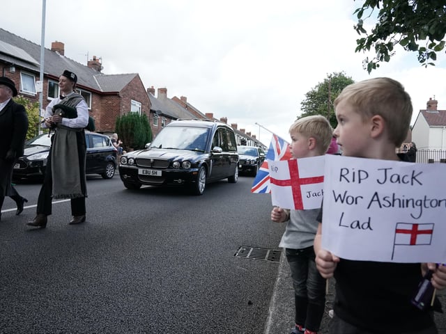People line the streets as the funeral cortege of Jack Charlton passes through his hometown of Ashington, in Northumberland ahead of his funeral service at West Road Crematorium, in Newcastle