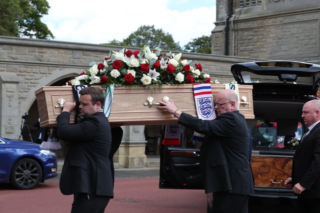 The coffin of Jack Charlton is taken into  West Road Crematorium, in Newcastle for his funeral