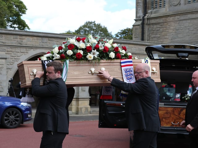 The coffin of Jack Charlton is taken into West Road Crematorium, in Newcastle for his funeral