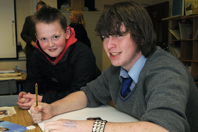 Sean looks on as Kevin McCormick demonstrates his artistic ability during the Open Night at St. Patrick's College, Maghera.mm03-135ar.