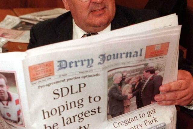 SDLP leader, John Hume , reads a copy of the Derry Journal as he awaits the results of the continuing count for the Foyle seat, in the Northern Ireland Assembly