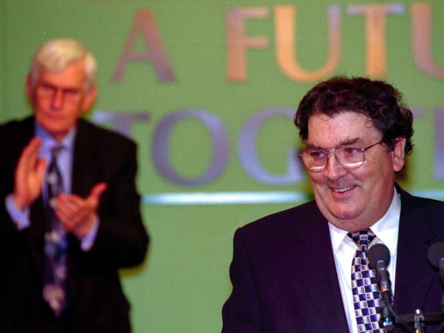 S.D.L.P Leader John Hume (right) receives a standing ovation from his party colleagues at the S.D.L.P. party conference at the Canal Court Hotel Newry