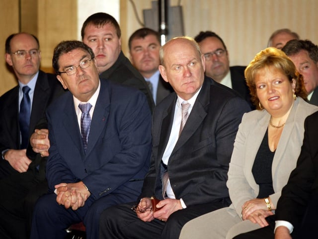 John Hume (second left), former leader of the SDLP, listens with party colleagues as as the party's then leader, Mark Durkan, launches his party's manifesto in Belfast, ahead of the Northern Ireland Assembley elections on November 26, 2003.