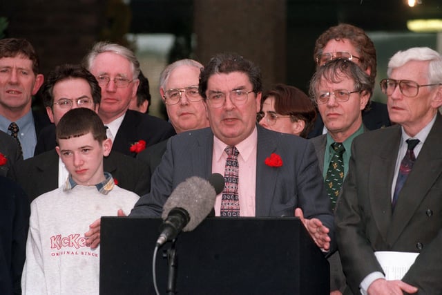 SDLP party leader John Hume and his talks team emerge from Castle Buildings to give their take on the signing of the Good Friday Agreement.