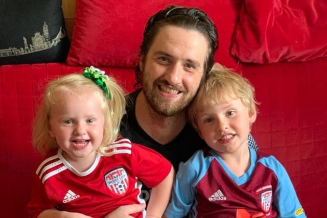 Derry man Brendan Henderson pictured with his daughter Niamh and son Misha in Moscow ready to watch Derry City's clash against Sligo Rovers, on the new WATCHLOI streaming service.