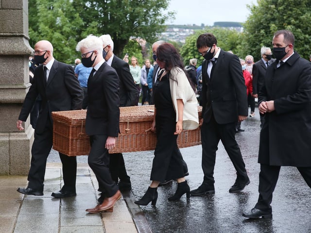 The remains of the late John Hume arriving at St. Eugene's Cathedral
