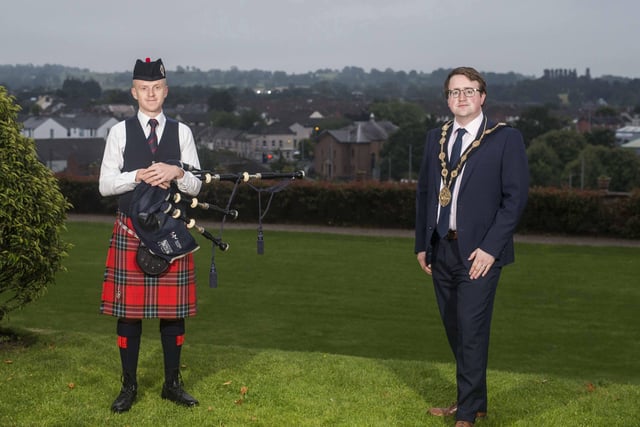 Lisburn & Castlereagh City Council commemorated the 75th Anniversary of VJ Day on Saturday August 15 with an event at sunrise and one at sunset. Mayor Councillor Nicholas Trimble joined piper Alastair Donaghy in the historic Castle Gardens at 6am to mark the conclusion of World War Two 75 years on.  The piper played Battle’s O’er as a fitting tribute to the veterans of VJ Day at the same time as other nations across the world. Picture Steven McAuley/McAuley Multimedia
